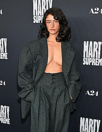Odessa A'zion braless attends Marty Supreme Los Angeles premiere at Samuel Goldwyn Theater