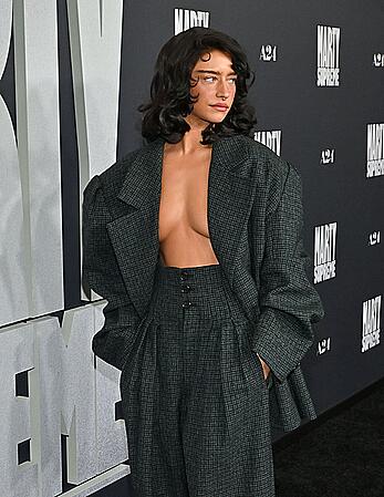 Odessa A'zion braless attends Marty Supreme Los Angeles premiere at Samuel Goldwyn Theater