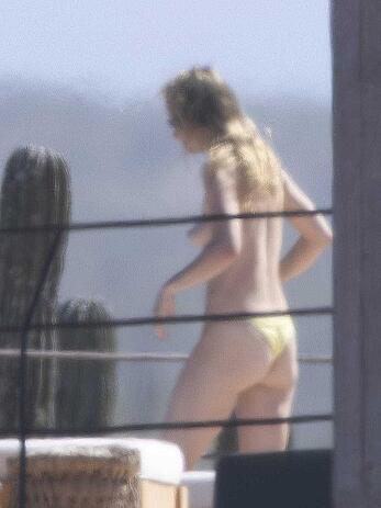 Olivia Wilde soaking up in the sun topless in Mexico - February 11, 2026