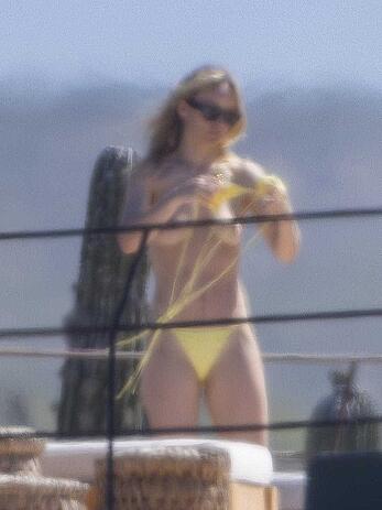 Olivia Wilde soaking up in the sun topless in Mexico - February 11, 2026