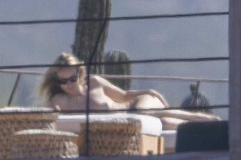 Olivia Wilde soaking up in the sun topless in Mexico - February 11, 2026