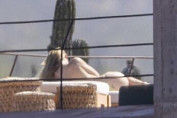 Olivia Wilde soaking up in the sun topless in Mexico - February 11, 2026