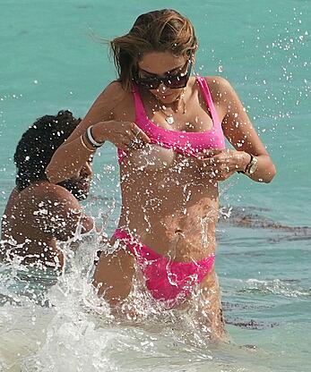 Patricia Contreras tit slip in poink bikini at the beach in Miami