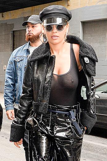 Rita Ora in see through black top in NYC