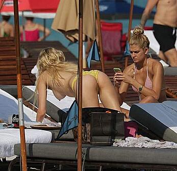 Shayna Terese Taylor and Kristen Nicole topless on a beach