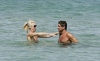Tamara Beckwith topless on a beach with friend