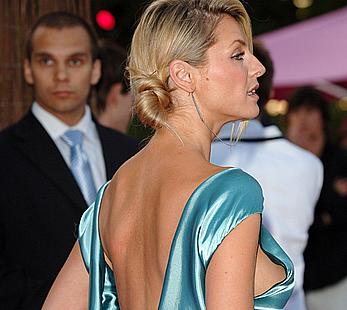 Tess Daly oops, shows side of boob and areola slip