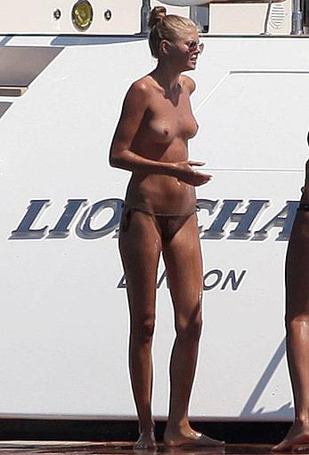 Toni Garrn in bikini and topless on a yacht in Ibiza