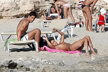 Belen Rodriguez caught topless on the beach in Spain