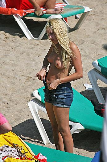 Peaches Geldof sunbathing topless on a beach paparazzi photos