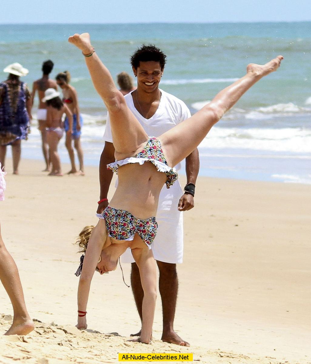 Kelly Brook sexy in bikini on the beach in Brazil.